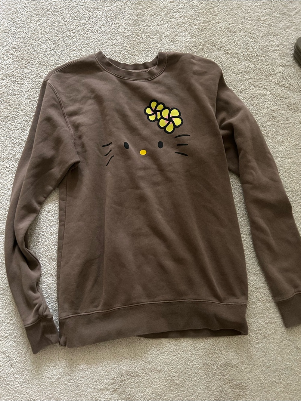 ALOHA Collection X SANRIO Brown Sweatshirt with Yellow Floral Hello Kitty Face